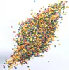 A pile of colorful sprinkles on a white background. Produktbild-Vorschau