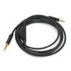 A black audio cable with gold connectors is coiled on a white background. Anteprima dell’immagine prodotto