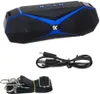 A black and blue Bluetooth speaker with its accessories, including a charging cable and a strap, laid out against a white background. Produktbild-Vorschau