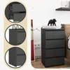 A collage of images showing a gray chest of drawers with multiple drawers, including close-ups of the drawers and the top of the unit. Produktbild-Vorschau