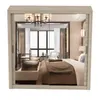A mirrored reflection of a bedroom interior, showing a bed, furniture, and decor. Voir les images du produit