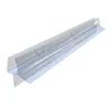 A clear plastic shower seal with water droplets on it, shown diagonally against a white background. Podgląd zdjęcia produktu