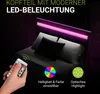 A person's hand holding a remote control for a bed with integrated LED lighting. Náhľad obrázku produktu