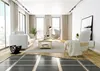 A modern living room with a floor heating system partially installed. Produktbild-Vorschau