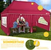 A family enjoying a meal under a red pop-up gazebo in a grassy garden. Produktbild-Vorschau
