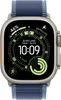 A close-up of an Apple Watch Ultra with a digital watch face displaying time, location, and activity data. Produktbild-Vorschau