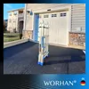 A folded ladder is placed on a driveway in front of a garage door. Náhľad obrázku produktu