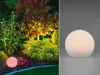 A split image showing a garden illuminated by outdoor lights on the left and a close-up of a spherical outdoor light on the right. Produktbild-Vorschau