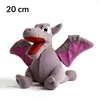 A plush toy of a dragon-like creature is sitting on a white background. Produktbild-Vorschau