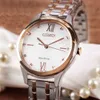 A close-up shot of a Citizen Eco-Drive women's watch with a white dial and rose gold accents, placed on a white cloth with pearls. Podgląd zdjęcia produktu