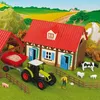 A toy farm set with a house, tractor, trailer, animals, and a farmer figure, set in a stylized rural landscape. Produktbild-Vorschau