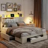 A bedroom scene featuring a bed with storage drawers and a headboard with integrated lighting. Podgląd zdjęcia produktu