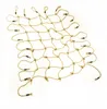 A tan climbing net with black connectors against a white background. Podgląd zdjęcia produktu
