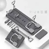 A multi-functional Pilates set is displayed on a white and light gray surface, with various attachments and components laid out. Produktbild-Vorschau