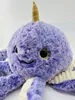 Close-up of a purple plush octopus toy with a narwhal horn. Produktbild-Vorschau