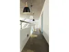 A modern hallway with concrete ceiling and walls, featuring several pendant lights. Anteprima dell’immagine prodotto
