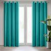 A pair of turquoise curtains hanging in front of a window. Produktbild-Vorschau