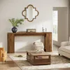 A living room scene featuring a console table, coffee table, armchair, and sofa. Náhľad obrázku produktu