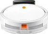 A white Xiaomi robot vacuum cleaner with an orange button on top and an orange latch on the front, sitting on a white background. A black charging dock is visible behind it. Voir les images du produit