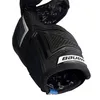 A close-up view of a black hockey elbow pad with blue accents and a white Bauer logo. Anteprima dell’immagine prodotto