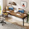 A long desk with two computer setups, office chair, and decorative items in a home office setting. Podgląd zdjęcia produktu