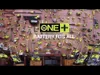A wall displaying a large collection of Ryobi power tools, with a prominent "ONE+ BATTERY FITS ALL" graphic in the center. Anteprima dell’immagine prodotto