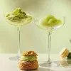 Desserts and drinks in glasses on a table. Produktbild-Vorschau