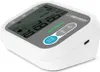 A white digital blood pressure monitor with a gray display screen and buttons, shown from a slightly elevated angle on a white background. Produktbild-Vorschau