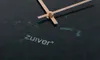 A close-up shot of a dark green marble clock face with rose gold hands. Náhľad obrázku produktu