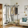 A corner of a room with a clothing rack, sofa, and door. Produktbild-Vorschau
