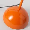 Close-up of the base of an orange lamp. Podgląd zdjęcia produktu