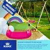 A split image showing a cartoon-like indoor scene with a rainbow and clouds on the left, and a real outdoor swing set on the right. A pink swing is prominently featured in the foreground. Produktbild-Vorschau