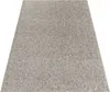 A rectangular rug with a textured, speckled gray and white pattern is shown from a slightly elevated diagonal angle against a white background. Produktbild-Vorschau