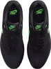 A top-down view of a pair of black Nike Air Max 1 Essential sneakers with green accents. Produktbild-Vorschau