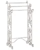 A white metal towel rack with three bars and decorative scrollwork on a white background. Náhled obrázku produktu