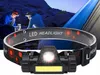 Two people are camping at night, using headlamps. Anteprima dell’immagine prodotto