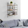 A wall shelf with decorative items and books above a sofa. Produktbild-Vorschau