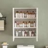 A white bathroom cabinet filled with various skincare products, mounted on a light green wall above a toilet. Produktbild-Vorschau