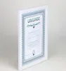 A framed certificate or document is shown against a light gray and white background. Produktbild-Vorschau
