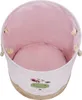 A top-down view of an empty, round laundry basket with a pink interior and a cartoon giraffe design on the exterior. Produktbild-Vorschau