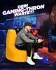 A man is sitting on a yellow beanbag chair in a gaming room, holding a game controller. Produktbild-Vorschau
