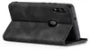 A black flip cover case for a smartphone is shown from a side angle, standing upright. Produktbild-Vorschau