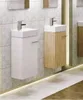 Two modern wall-mounted bathroom vanities with sinks are displayed side-by-side against a tiled wall. The vanity on the left is white, and the one on the right has a wood-grain finish. A strip of LED lighting runs along the floor beneath the vanities. Produktbild-Vorschau