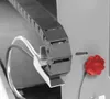 A close-up view of a black cable chain mechanism with a red knob on a gray machine. Anteprima dell’immagine prodotto