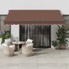 An outdoor patio scene with furniture and an awning. Anteprima dell’immagine prodotto