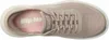 A top-down view of a beige Skechers slip-in shoe. Anteprima dell’immagine prodotto