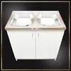 A white kitchen cabinet with a double stainless steel sink and faucet. Produktbild-Vorschau