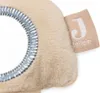 A close-up of a fabric tag on a plush toy. Produktbild-Vorschau