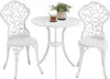 A white metal bistro set with two chairs and a table, with a potted plant and a cup of tea on the table. Produktbild-Vorschau