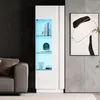 A modern living room with a white high-gloss display cabinet with blue LED lighting, a sofa, and abstract art on the wall. Produktbild-Vorschau